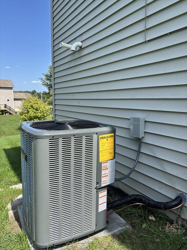 Completed full residential air conditioning system replacement including outdoor condensing unit and indoor air handler. Installed new outdoor unit on existing concrete pad with proper electrical disconnect and refrigerant line connections. Mounted new indoor air handler in basement utility area with integrated ductwork connections, PVC condensate drainage, and electrical wiring. All components tested and verified operational upon completion.