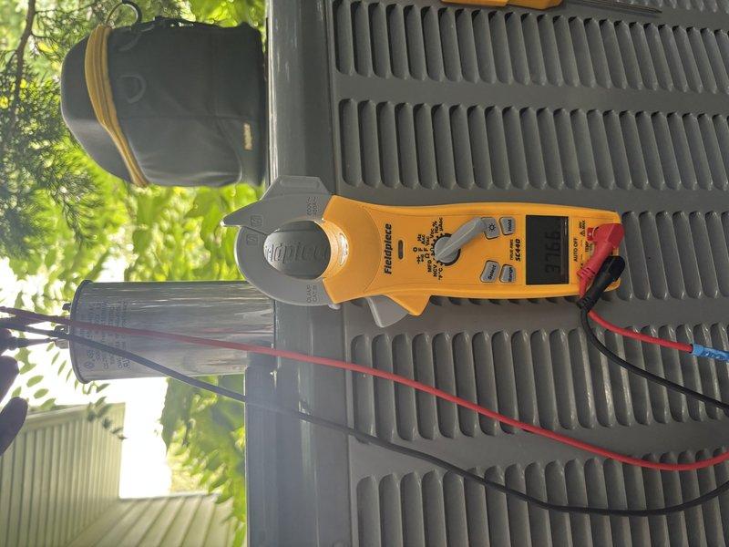 Completed annual cooling system tune-up and preventive maintenance on residential outdoor condensing unit. Performed comprehensive system diagnostics using digital clamp meter to verify electrical performance, including amperage readings and voltage checks at the control panel. Inspected all electrical connections, wiring, and components within the junction box, confirming proper operation of capacitor, contactors, and control devices. Unit operating within manufacturer specifications with no deficiencies noted.
