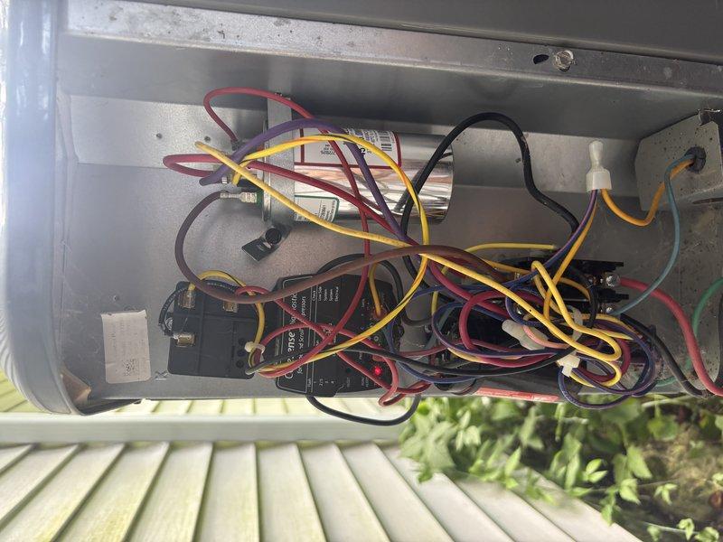 Completed annual cooling system tune-up and preventive maintenance on residential outdoor condensing unit. Performed comprehensive system diagnostics using digital clamp meter to verify electrical performance, including amperage readings and voltage checks at the control panel. Inspected all electrical connections, wiring, and components within the junction box, confirming proper operation of capacitor, contactors, and control devices. Unit operating within manufacturer specifications with no deficiencies noted.