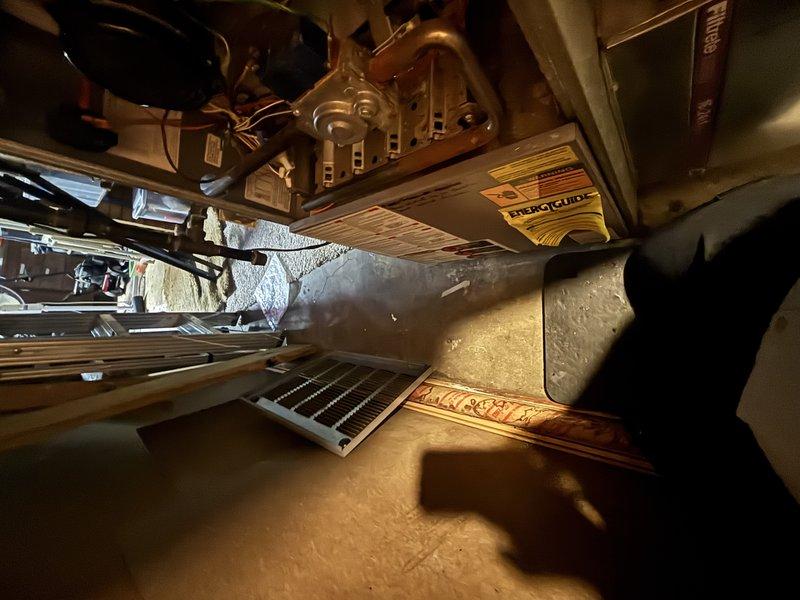 Completed annual cooling maintenance on 23-year-old Weather King air conditioning system with condenser manufactured in 2011. Accessed equipment in crawl space, performed standard tune-up procedures including inspection of ductwork, refrigerant lines, and mechanical components. All systems photographed and documented, with insulated piping and mechanical connections showing normal age-related wear but remaining operational.