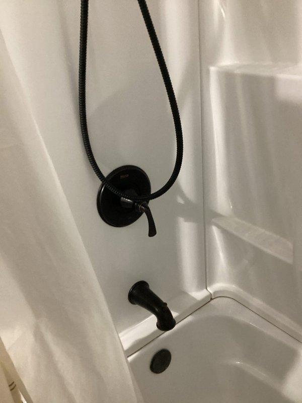 Conducted comprehensive plumbing project estimate for residential property requiring conversion of existing sprinkler irrigation system from well water supply to municipal water connection, replacement of two standard toilets with full-height fixtures, installation of new faucets, and replacement of two sink units. Assessed existing bathroom plumbing infrastructure including current toilet configuration with chrome flush mechanism and existing black matte finish tub/shower fixtures. Documented current conditions and provided detailed scope of work for sprinkler system conversion, toilet replacements, faucet installations, and sink upgrades.