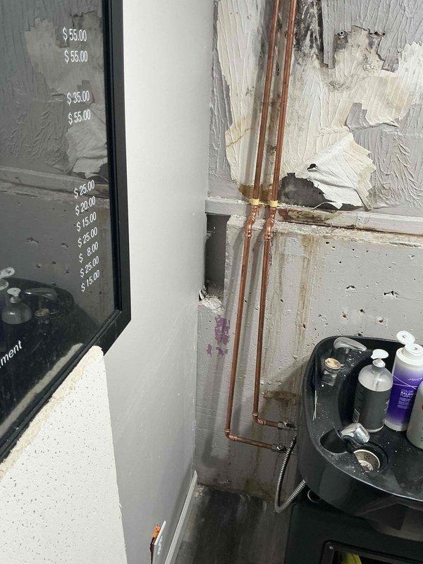 Replaced deteriorated copper piping in utility room mechanical corner, installing new brass fittings and connections to restore proper system function. Work addressed water damage concerns in the affected area, with all plumbing connections tested and verified operational upon completion.