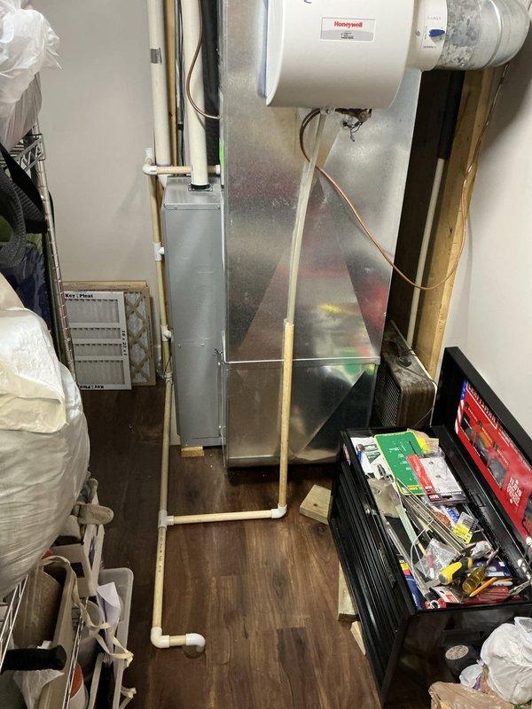 Provided estimate for new furnace installation at side-by-side residence with existing 20-year-old unit. Inspected current HVAC system including furnace, ductwork, humidifier, PVC condensate drainage system, and air handler components in utility space. Documented existing equipment configuration and installation area for replacement planning.