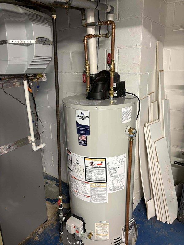 Corrected disapproved gas piping installation on water heater to meet code requirements. Installed proper gas shut-off valve with red handle at water heater connection and rectified improperly installed drip leg on gas line per inspection requirements. Verified all gas connections are secure with appropriate Teflon tape application on threaded fittings, ensuring safe and compliant operation. Reinspection has been scheduled to obtain final approval.