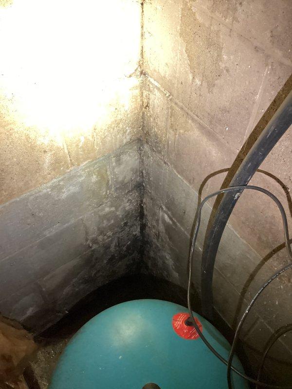 Responded to service call for low water pressure at outdoor spigot. Upon inspection, identified moisture intrusion issues in basement utility area with visible mold growth on concrete surfaces near plumbing connections. Examined exterior hose bib and associated supply lines, checking for obstructions, valve functionality, and potential leaks affecting water flow. Assessed HVAC condensate drain routing near exterior spigot location to rule out cross-connection or drainage interference. Documented existing conditions with photographs showing interior water damage and exterior plumbing configuration for customer records and potential follow-up remediation work.