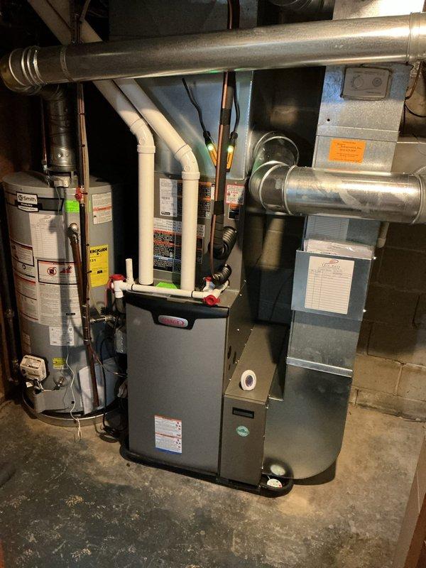 Completed comprehensive AC tune-up on 31-year-old Lennox model CK40CT-24B-71 system. Performed standard maintenance procedures including inspection of all mechanical components, verified proper refrigerant charge for R-454B system, checked electrical connections, and confirmed operational efficiency of the unit and associated ductwork in the basement mechanical room.