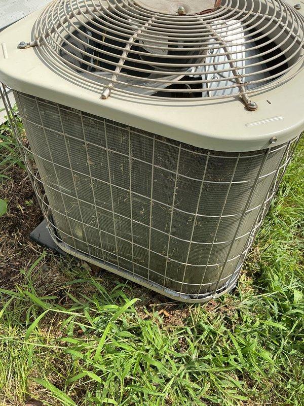 Completed annual cooling maintenance on 8-year-old Payne air conditioning system with 2021 condenser model. Performed comprehensive tune-up including inspection of outdoor unit, verified proper operation of fan assembly and motor, checked refrigerant levels and system pressures, cleaned condenser coils and protective grille which showed moderate dirt and debris accumulation from outdoor exposure, inspected electrical connections and capacitor, verified proper airflow through mesh screening, and tested overall system performance. Unit operational and ready for cooling season.