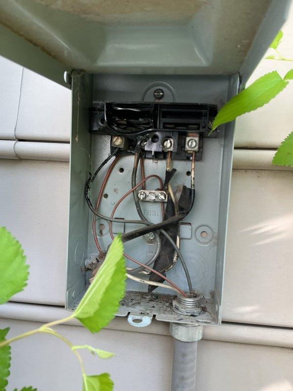 Completed annual cooling maintenance on 17-year-old Carrier air conditioning system. Performed standard inspection of electrical disconnect box, verifying proper wire connections, terminal tightness, and breaker operation; documented equipment condition with photos showing outdoor disconnect enclosure with some age-related weathering but functional components. All electrical connections secure and system operational upon completion of preventive maintenance visit.