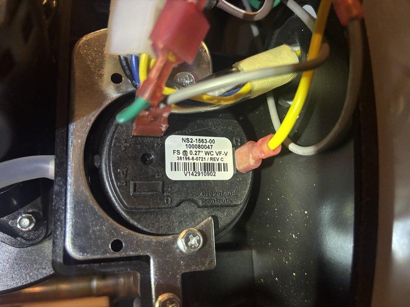 Responded to no hot water complaint on 4-year-old water heater. Upon inspection, diagnosed faulty pressure switch (part #NS2-1563-00) preventing unit from firing. Replaced defective pressure switch, verified proper electrical connections, tested unit operation, and confirmed restoration of hot water production.