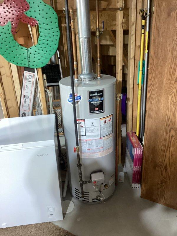 Responded to service call for malfunctioning sump pump with odor complaint. Upon arrival, conducted thorough inspection of basement utility area and mechanical systems. Assessed water heater, plumbing connections, and surrounding infrastructure for potential sources of malfunction and foul odor. Documented existing conditions through photographic evidence showing utility room layout, exposed framing, and mechanical equipment placement. Identified sump pump failure and investigated drainage system for blockages or stagnant water causing odor issues. Performed necessary repairs to restore proper pump operation and addressed sanitation concerns in the sump basin area.