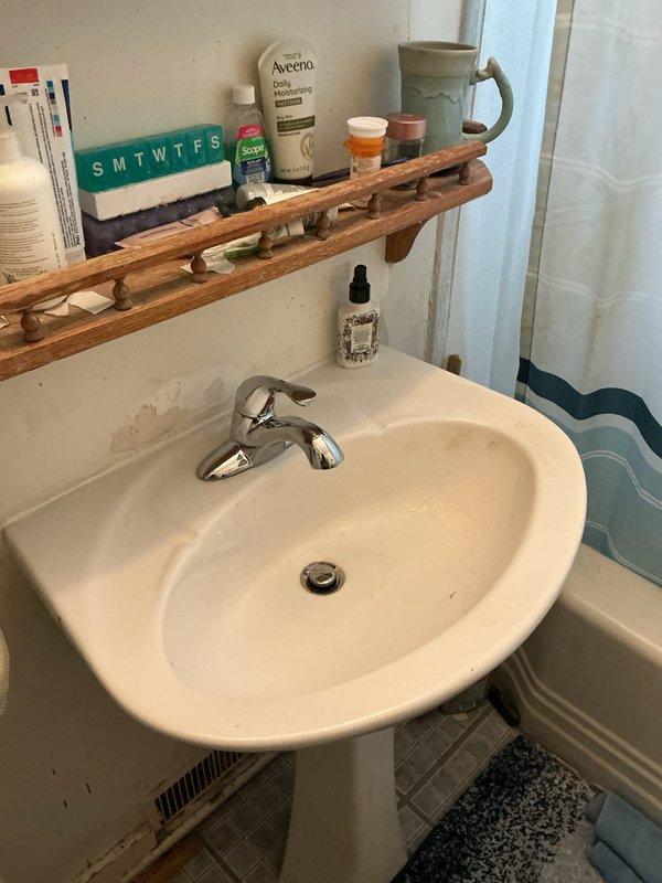 Responded to service call for malfunctioning bathroom faucet in 1943-era residential property. Upon arrival, inspected chrome single-handle faucet mounted on white pedestal sink and diagnosed ongoing leak issue. Performed necessary repairs to restore proper function and water flow control, ensuring no residual dripping or operational concerns. Verified all components were properly sealed and tested faucet operation through multiple cycles to confirm repair integrity.