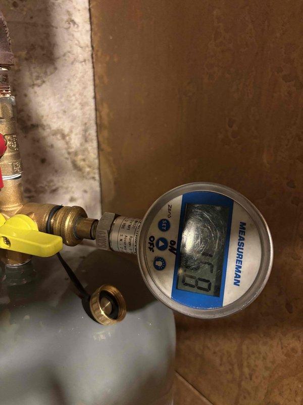 Replaced failed expansion tank and malfunctioning 30 lb pressure relief valve on hydronic heating system that had exceeded safe operating pressure, reaching 39 psi. Installed new Amtrol expansion tank with brass fittings, ball valve assembly, and digital pressure gauge to monitor system pressure and prevent future over-pressurization. System tested and verified operating within normal pressure parameters.