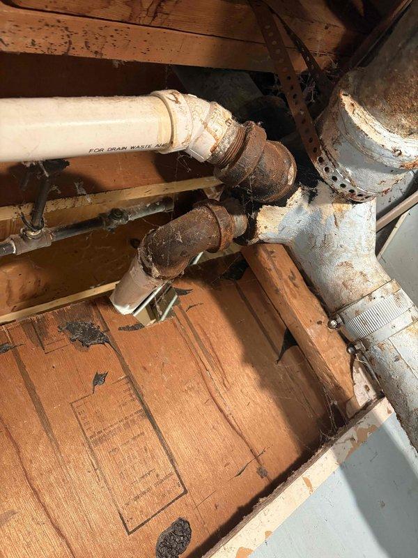 Responded to water leak call and completed plumbing reroute to address improper drainage issue. Kitchen sink drain line was redirected in basement area to prevent water from discharging directly onto washing machine. Installed new PVC drain waste piping with appropriate fittings and connections to properly route wastewater away from appliances. All connections secured and tested for proper drainage flow.