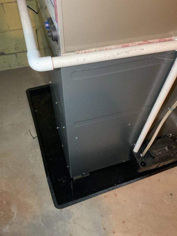 Responded to no cooling call on two-year-old Carrier system with complete loss of heating and cooling operation. Accessed furnace control board and electrical components to diagnose issue. Inspected air handler unit, condensate drain system, and ductwork connections. Documented equipment condition and internal wiring configuration for service records.