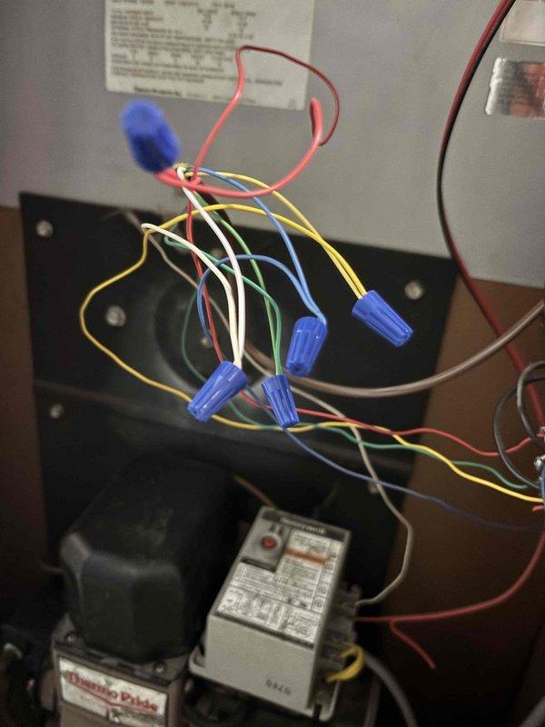 Responded to service call for cooling system running constantly when thermostat was in the off position. Upon arrival, confirmed thermostat was set to AUTO mode rather than ON, which was causing continuous system operation. Inspected HVAC unit interior components including electrical connections, wire terminations with wire nuts, control relay switches, and motor assembly to verify proper operation and rule out any control circuit failures. Checked electrical wiring configuration and confirmed all connections were secure. Educated customer on proper thermostat operation and the difference between AUTO and ON fan settings to prevent future confusion and unnecessary system runtime.