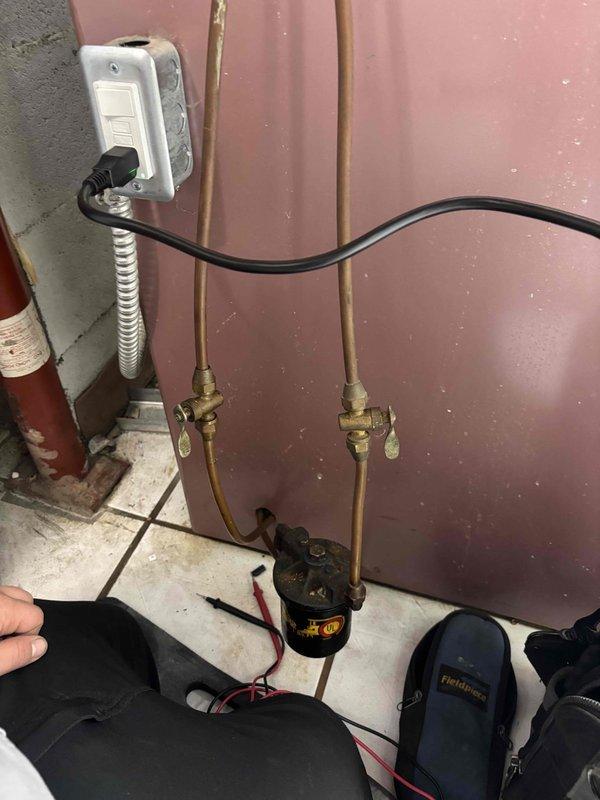 Responded to service call for cooling system running constantly when thermostat was in the off position. Upon arrival, confirmed thermostat was set to AUTO mode rather than ON, which was causing continuous system operation. Inspected HVAC unit interior components including electrical connections, wire terminations with wire nuts, control relay switches, and motor assembly to verify proper operation and rule out any control circuit failures. Checked electrical wiring configuration and confirmed all connections were secure. Educated customer on proper thermostat operation and the difference between AUTO and ON fan settings to prevent future confusion and unnecessary system runtime.