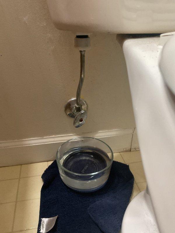 Responded to upstairs master bathroom toilet tank leak. Upon inspection, identified leaking supply line connection at the tank. Replaced faulty supply line with new chrome-finished braided stainless steel line, installed new angle stop valve, and tested system for proper operation with no further leakage detected.