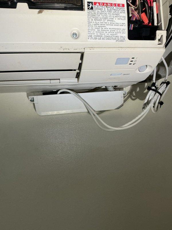 Replaced failed condensate pump on mini-split air handler system. Disconnected power at safety switch, removed old pump assembly, installed new condensate pump unit, reconnected electrical wiring to control box terminals, and verified proper drainage operation. System tested and confirmed operational with no leaks detected.