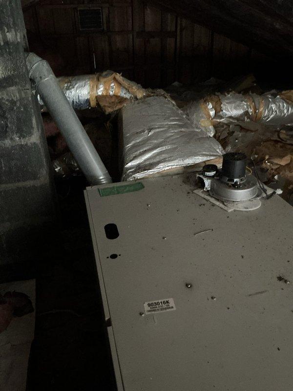 Conducted site assessment of existing furnace system in attic installation with deteriorating chimney exhaust conditions as noted by previous technician. Documented current HVAC equipment condition, ductwork configuration, and surrounding structural environment through photographic documentation. Prepared comprehensive estimate for chimney liner installation and discussed furnace replacement options with customer to address safety concerns related to crumbling chimney structure around furnace exhaust vent.