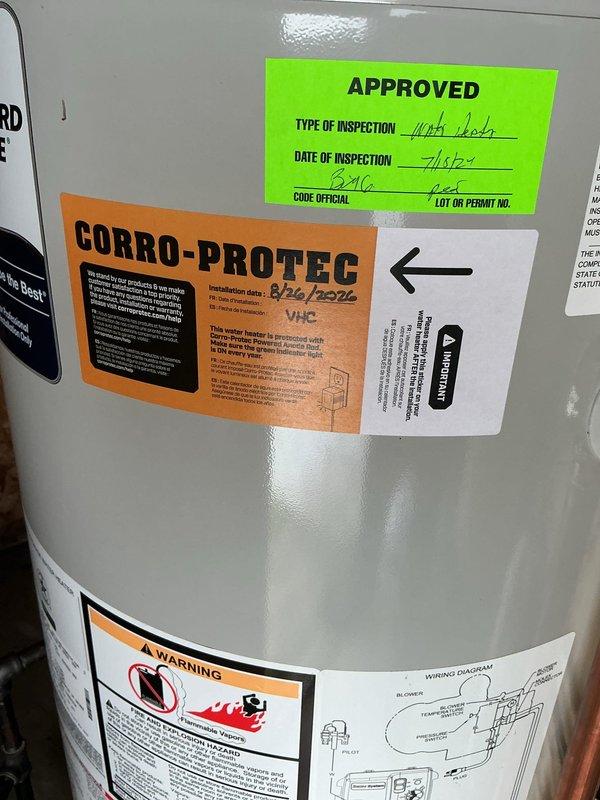 Installed Corro-Protec powered anode rod system on existing water heater to prevent tank corrosion and extend equipment lifespan. Connected powered anode to dedicated electrical outlet, verified proper operation, and documented installation with updated labeling on tank.