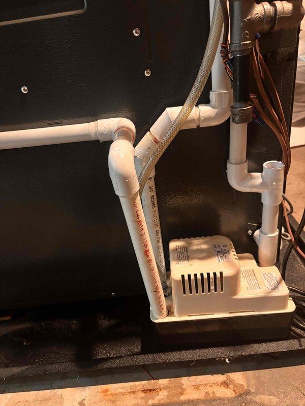 Completed annual cooling maintenance on EnergiAir system with warranty coverage through October 2031. Inspected condensate pump assembly and PVC drainage system, confirming proper operation and secure connections. Evaluated and documented heavily soiled air filter showing significant dust and debris accumulation. Verified best contact number on file for future service needs.