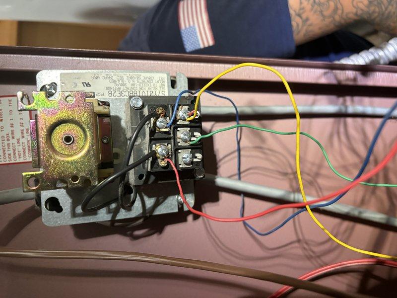 # CP-Cooling Problem

Return visit to diagnose system running constantly when thermostat in off position with fan set to auto mode. Inspected EnergiAir WT 08-2031 unit wiring and control circuits. Examined transformer/relay assembly and verified proper terminal connections at equipment. Checked ecobee thermostat wiring configuration including R, C, W1, W2, G, Y1, Y2, and OB terminals to ensure correct connections and eliminate potential wiring faults causing continuous operation. Documented equipment condition and wiring setup with photographs for diagnostic reference and future service needs.