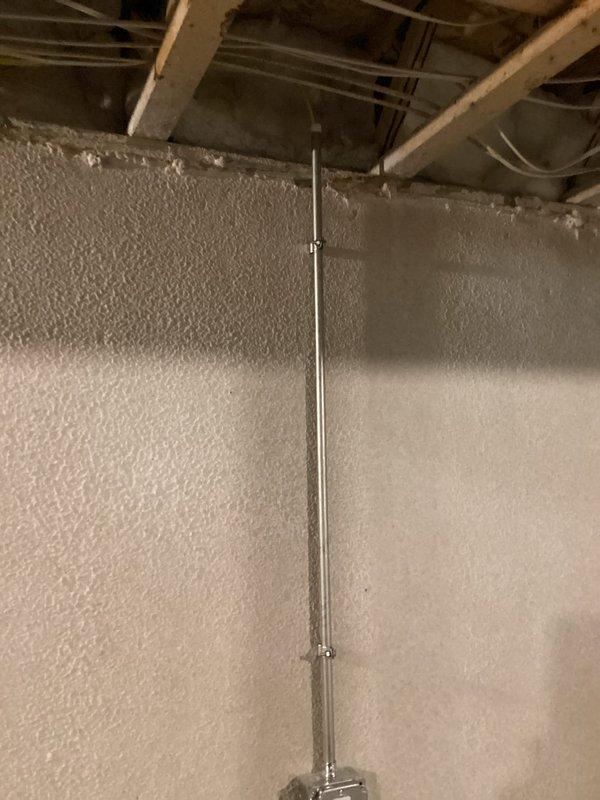 Completed electrical estimate for installation of new 120V receptacle outlet in basement approximately 20-25 feet from main electrical panel. Assessed existing spray foam insulated utility space with exposed ceiling joists and determined optimal routing path for conduit installation to power new outlet location while maintaining code compliance.