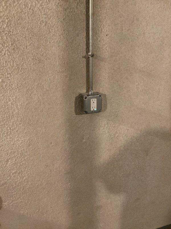 Completed electrical estimate for installation of new 120V receptacle outlet in basement approximately 20-25 feet from main electrical panel. Assessed existing spray foam insulated utility space with exposed ceiling joists and determined optimal routing path for conduit installation to power new outlet location while maintaining code compliance.