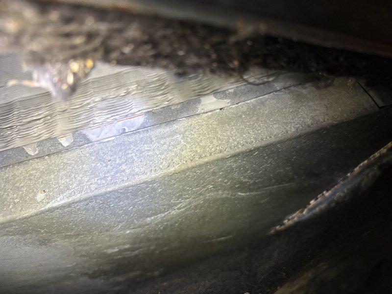 Completed annual cooling maintenance on 18-year-old Payne air conditioning system. Discovered evaporator coil heavily frosted during inspection, indicating restricted airflow from severely clogged air filter. Replaced dirty filter with new unit and allowed system to defrost before verifying proper operation and airflow restoration.
