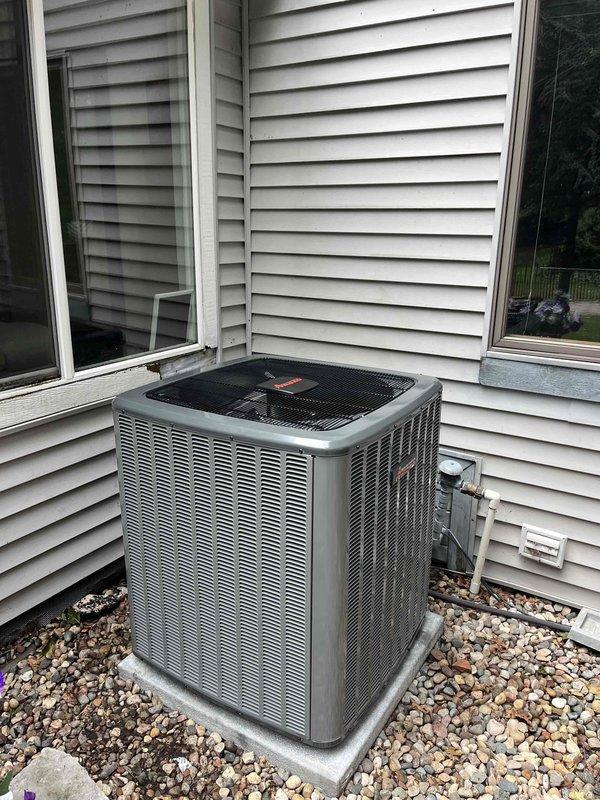 Completed full HVAC system replacement including outdoor condensing unit and indoor air handler/furnace components. Installed new outdoor condenser on existing concrete pad with proper refrigerant line connections and electrical conduit run through exterior wall. Mounted new indoor equipment in basement utility area with vertical ductwork connections and proper ventilation configuration. All units positioned per manufacturer specifications with required clearances, warning labels properly affixed, and electrical connections completed to code. System tested and verified operational upon completion.