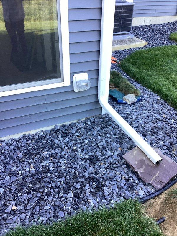 Completed electrical estimate for new construction residential property requiring additional outlet installations in main dwelling and detached shed. Assessed basement utility room with exposed insulation and laundry fixtures, as well as exterior foundation area with existing electrical infrastructure including dryer vent. Documented existing conditions and electrical access points to determine optimal routing for new circuit installations and outlet placement throughout the property.