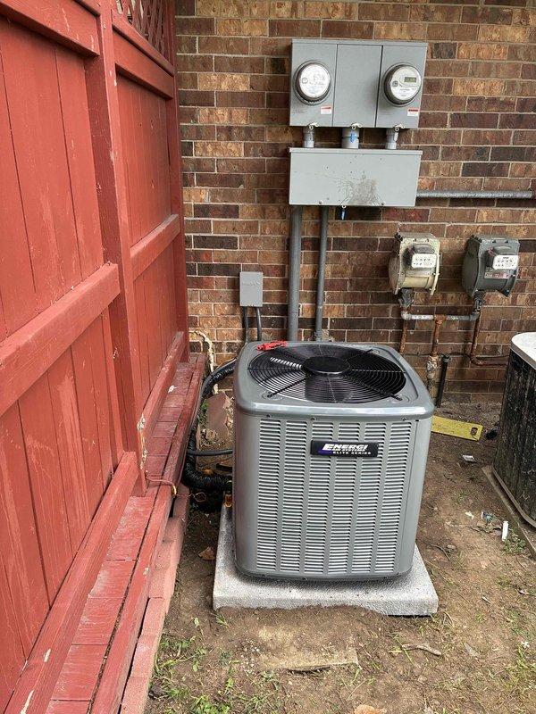 Completed full AC replacement installation at residential property. Removed existing air conditioning system and installed new American Standard condenser unit on concrete pad against exterior brick wall. Ran new refrigerant line set with proper insulation from outdoor unit to interior air handler. Installed electrical disconnect, verified proper power supply connections to existing meter panel, and ensured all electrical conduits met code requirements. Leveled and secured outdoor unit, tested system operation, verified proper refrigerant charge, and confirmed all components functioning within manufacturer specifications.