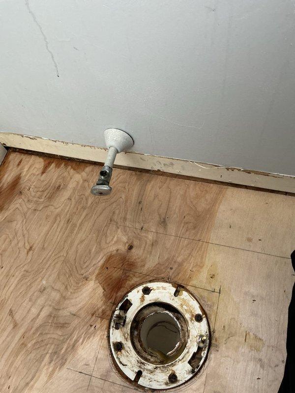 Responded to water leak service call and shut off water supply valves to the laundry area and toilet to prevent further water damage. Removed toilet to access plumbing fixtures, exposing the toilet flange and underlying drain pipe for inspection and repair. Installed furnace filter and performed air conditioning system maintenance as additional preventive service during the visit.