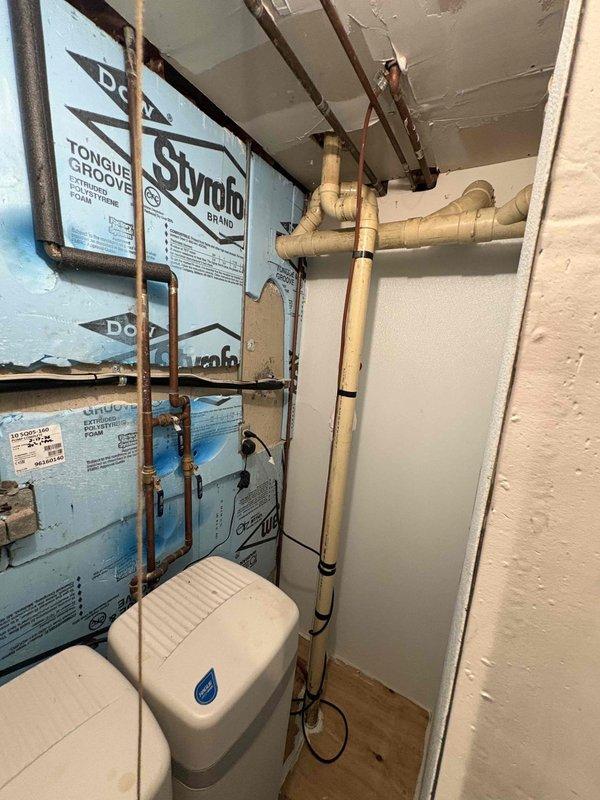 Responded to plumbing leak complaint at previously installed Aquatru under-sink water filtration system. Upon inspection, identified moisture accumulation in cabinet and along filter connection lines. Examined all compression fittings, tubing connections, and filter housing seals throughout the multi-stage filtration assembly. Tightened loose connections at filter inlet/outlet points and replaced compromised O-rings on filter housings. Verified all copper supply lines and plastic tubing connections for proper seating and secure attachment. Dried affected cabinet surfaces and monitored system under pressure to confirm leak resolution and proper operation of filtration unit.