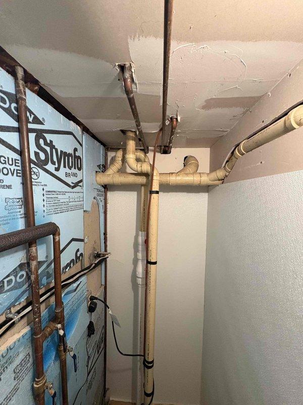 Responded to plumbing leak complaint at previously installed Aquatru under-sink water filtration system. Upon inspection, identified moisture accumulation in cabinet and along filter connection lines. Examined all compression fittings, tubing connections, and filter housing seals throughout the multi-stage filtration assembly. Tightened loose connections at filter inlet/outlet points and replaced compromised O-rings on filter housings. Verified all copper supply lines and plastic tubing connections for proper seating and secure attachment. Dried affected cabinet surfaces and monitored system under pressure to confirm leak resolution and proper operation of filtration unit.