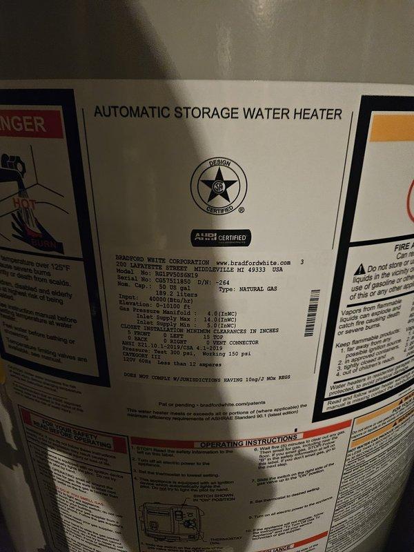 Installed new Bradford White 50-gallon automatic storage water heater in basement utility room. Connected all water supply lines using copper piping, installed PVC venting system, and completed electrical connections per manufacturer specifications. Unit tested and verified operational with all safety labels and energy guide documentation properly displayed.
