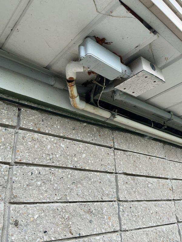 Completed annual cooling system tune-up and maintenance inspection on residential AC system. Investigated reported leak from air handler drain line and identified rust staining on exterior condensate drain piping at soffit area, indicating potential drainage issues requiring monitoring. Performed standard system diagnostics and operational testing on outdoor condenser unit, confirming proper function of all components.