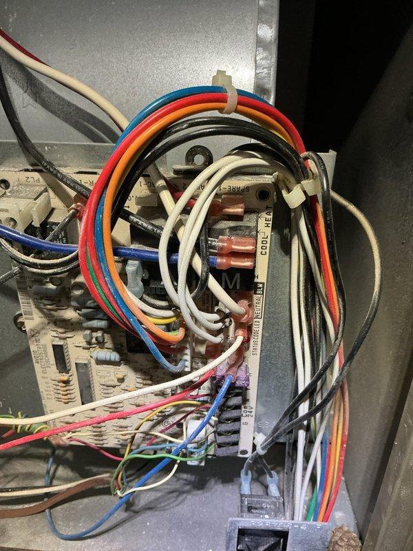 Responded to water leak complaint with AC unit dripping on ceiling from upstairs location. Upon inspection, documented HVAC unit specifications showing Goodman CAC/BDP model CVPVA3617XM0EAAA manufactured May 2024, utilizing R-410A refrigerant. Examined condensate drainage system and internal components including control board wiring and electrical connections to identify source of water intrusion. Photographed unit nameplate data and internal wiring configuration for service records and further diagnostic evaluation.