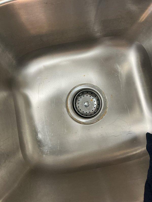 Responded to callback regarding recently installed kitchen faucet. Customer expressed dissatisfaction with faucet selection and reported active leak from the installation completed earlier this week. Upon inspection, documented current condition of double-basin stainless steel sink and existing drain assemblies. Assessed faucet installation and identified source of leak. Discussed alternative faucet options with customer to address aesthetic preferences and ensure proper selection for replacement. Prepared work area for faucet removal and reinstallation with customer-approved fixture to resolve both the leak issue and customer satisfaction concerns.