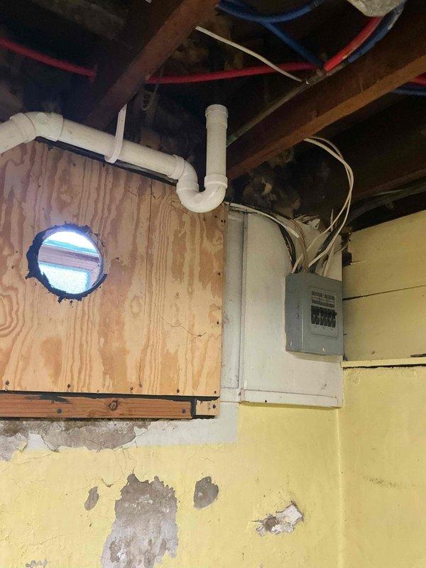 Responded to laundry drainage overflow issue following previous unsuccessful snaking attempt. Inspected basement utility area plumbing system and drainage lines serving laundry area. Performed thorough cable snaking of main drain line to remove blockage causing backup during washing machine discharge cycle. Cleared obstruction and verified proper drainage flow to prevent future flooding during laundry operations.
