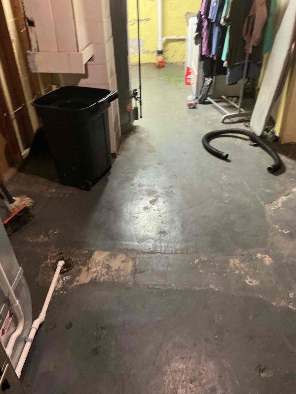 Responded to laundry drainage overflow issue following previous unsuccessful snaking attempt. Inspected basement utility area plumbing system and drainage lines serving laundry area. Performed thorough cable snaking of main drain line to remove blockage causing backup during washing machine discharge cycle. Cleared obstruction and verified proper drainage flow to prevent future flooding during laundry operations.