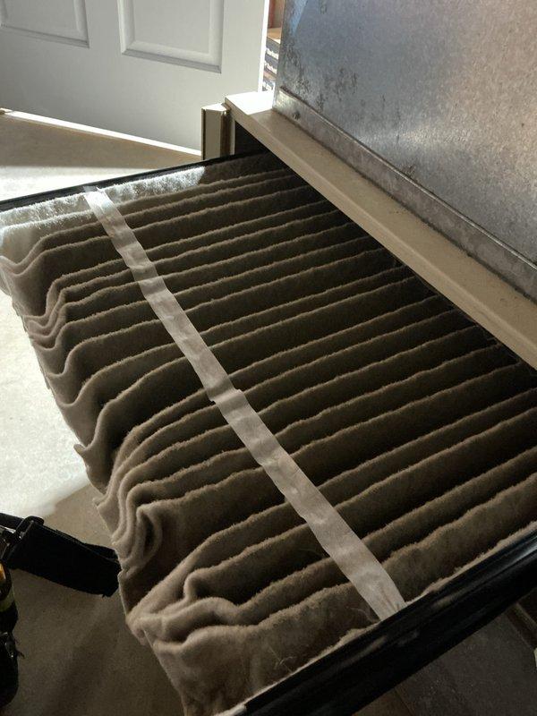 Completed annual cooling maintenance on 8-year-old Lennox system. Inspected air filter showing dust accumulation, checked outdoor unit motor assembly, and performed electrical diagnostics with clamp meter reading 12.83 amps. System operational and ready for cooling season.