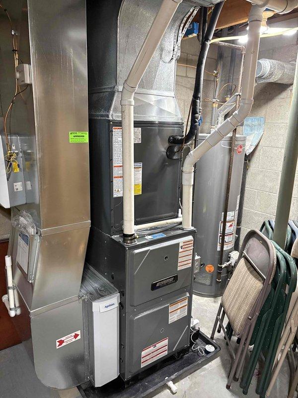 Completed evaporator coil and drain pan replacement on residential HVAC system. Removed failed evaporator coil assembly from furnace plenum and installed new coil with updated drain pan to restore proper cooling function and prevent water damage from condensate leakage.