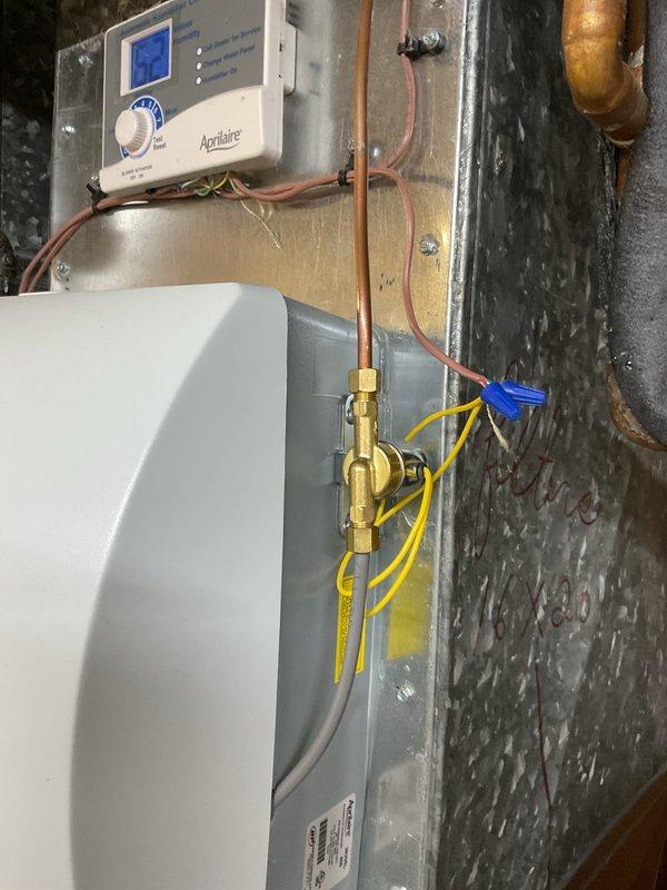 Completed annual cooling maintenance on 2021 EnergiAir system under warranty through 12-2028. Performed comprehensive tune-up including inspection of evaporator coil, condensate drain system with visible water accumulation in drain pan, and verified proper operation of Aprilaire humidifier control. All mechanical components, refrigerant lines, and electrical connections inspected and found operational.
