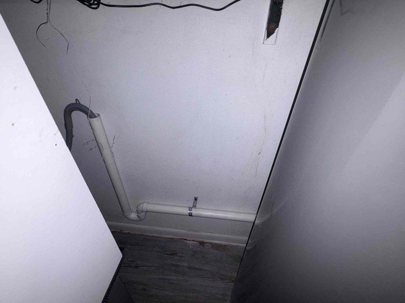 Replaced failed sump pump unit and upgraded laundry drainage system by removing inadequate 1" electrical conduit previously used for drain line and installing proper 2" PVC piping with appropriate fittings and slope for code-compliant drainage. New sump pump installed and tested for proper operation, with all plumbing connections secured and system verified functional.