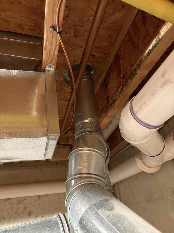 Responded to service call for 11-year-old Bradford White water heater with extinguished pilot light. Upon arrival, inspected unit and surrounding utility area, documented existing conditions including ductwork, plumbing connections, and water heater installation. Successfully diagnosed pilot light issue, relit pilot assembly, and verified proper ignition and burner operation to restore hot water service.