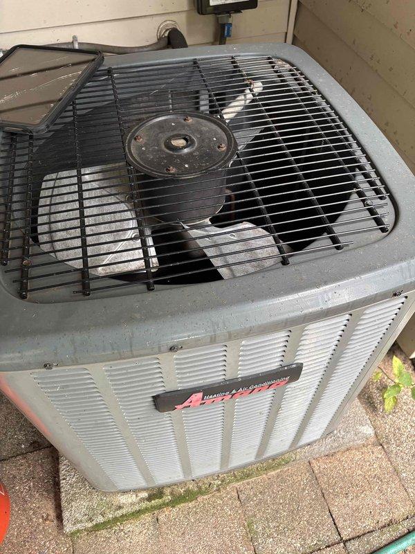 Responded to no-cool service call on 13-year-old residential air conditioning system where outdoor unit fan was not operating following recent tune-up. Diagnosed failed run capacitor preventing condenser fan motor from starting. Replaced defective 40 MFD dual capacitor with new unit, verified proper wire connections to compressor and fan motor terminals, and restored system to normal operation with condenser fan running correctly.