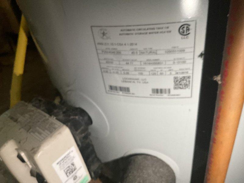 Responded to service call for leaking water heater approximately 10 years old. Upon arrival, performed visual inspection of unit and surrounding utility space to identify source of leak. Documented existing conditions with photographs showing water heater installation, piping connections, and overall equipment configuration. Unit exhibited signs of age-related deterioration consistent with end of typical service life for residential water heaters. Provided assessment and recommendations to customer regarding repair versus replacement options based on unit age and condition.