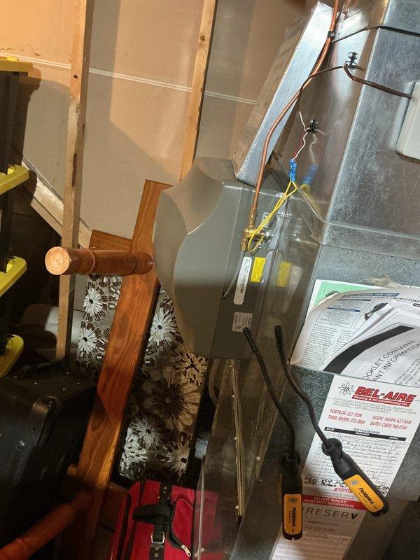Responded to no-cooling complaint on 20+ year old central air conditioning system affecting entire home. Upon arrival, found outdoor condensing unit completely inoperative with no power to compressor or condenser fan motor. Performed diagnostic testing at outdoor unit and traced electrical circuit back to indoor air handler and furnace location in basement. Identified failed contactor preventing outdoor unit from receiving proper voltage signal from thermostat. Replaced defective contactor with appropriate replacement part rated for system specifications. Verified proper voltage at contactor coil and through load contacts. Tested system operation through complete cooling cycle, confirming compressor and condenser fan motor startup, proper amperage draw on both components, and adequate airflow from indoor blower assembly. System restored to normal cooling operation with all components functioning within manufacturer specifications.