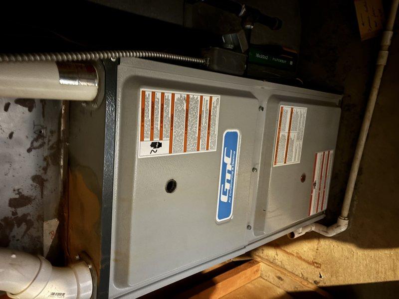 Completed comprehensive ASTU-AC Super Tune-up on 9-year-old residential HVAC system including outdoor condensing unit and indoor air handler located in attic space. Performed full system inspection, verified proper operation of all components, checked refrigerant lines and electrical connections on outdoor unit, inspected indoor furnace/air handler with all safety labels and specifications confirmed intact, and ensured both heating and cooling systems are functioning properly for the new homeowners.